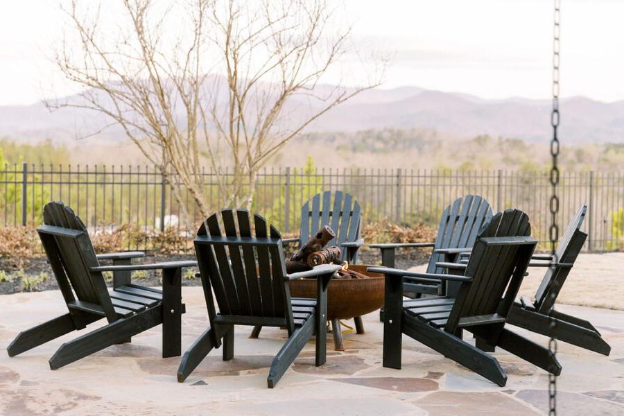 Adirondack chairs around a fireplace